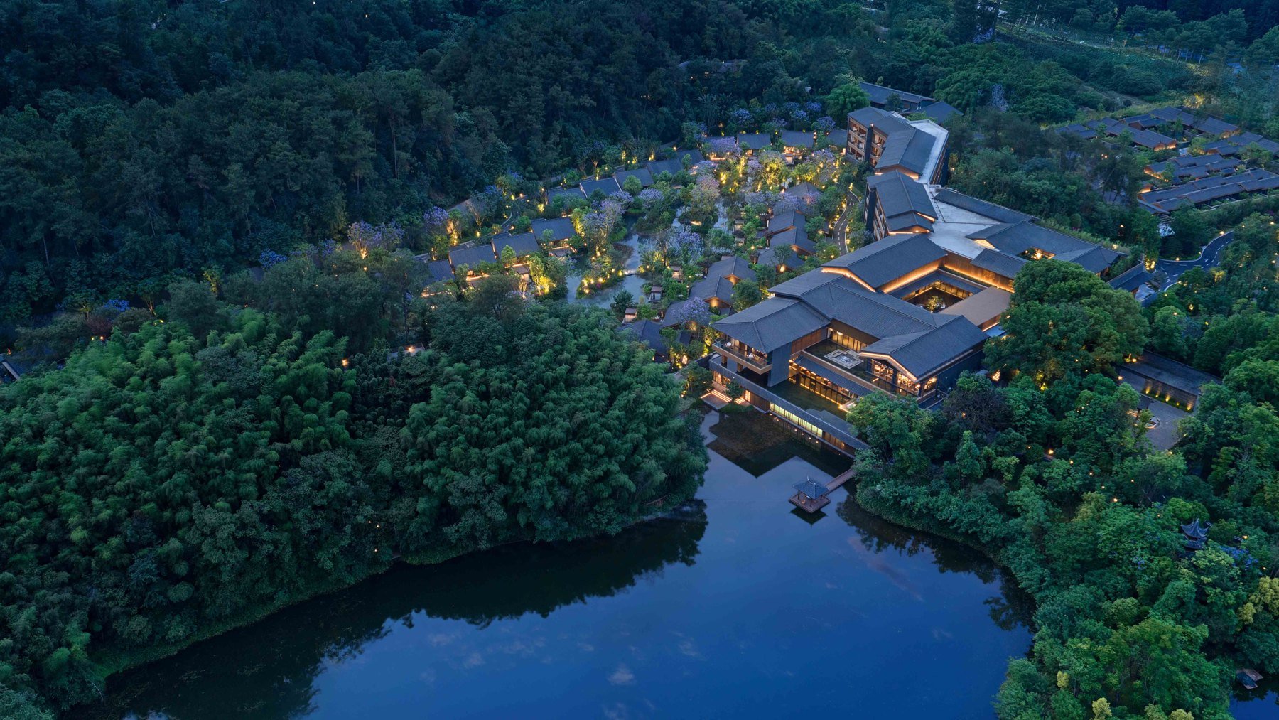 Banyan Tree Mount Emei resort among trees at night